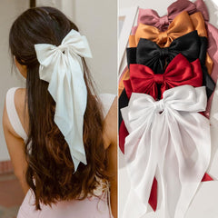 FDBJulyy bow clip worn with evening outfit adding refined finishing touch