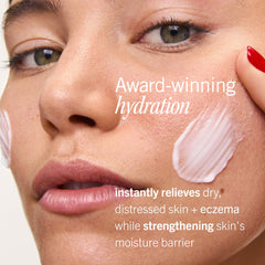 First Aid Beauty cream being applied to hands to soothe and moisturize dry skin