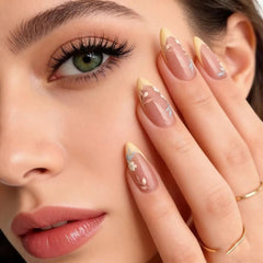 FJSMTOPl close-up of French tip and floral design, precise delicate detail