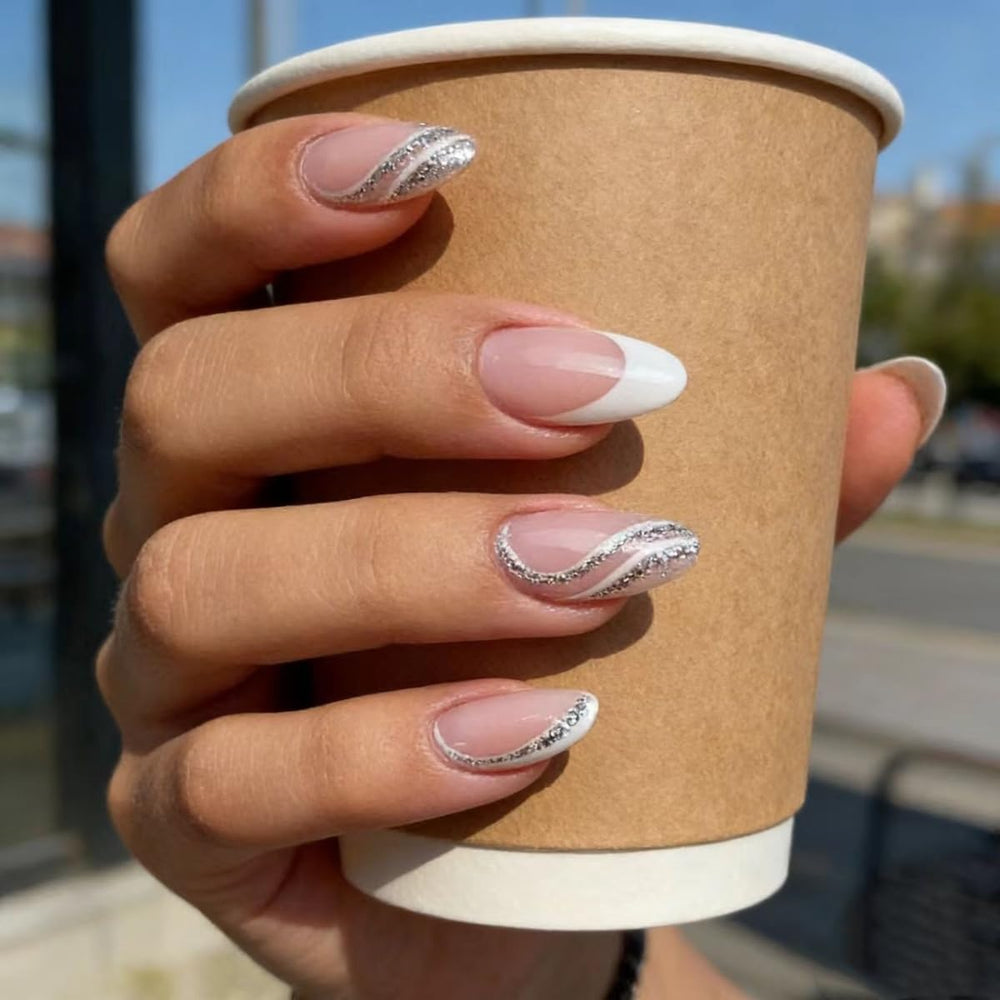FJSMTOPl close-up of white French tip almond nail highlighting glossy finish
