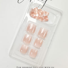 FJSMTOPl press-on toenail being applied for fast at-home pedicure