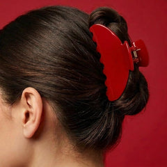 FlaSloth cherry red clip top closeup highlighting smooth acetate and durable spring benefit