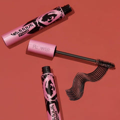 FLOWER Warrior Princess model applying mascara to lashes for visible lift and separation