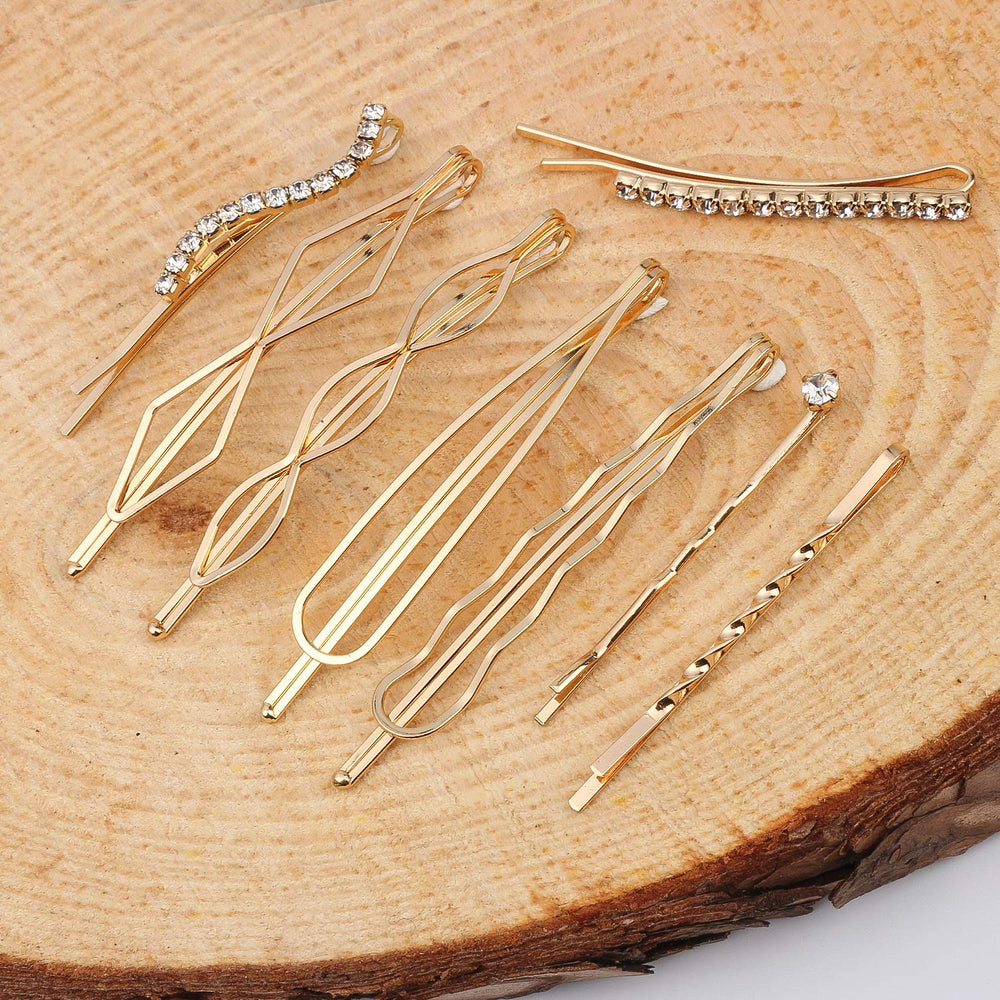 Folansy barrettes beside hand and ruler showing length range and scale