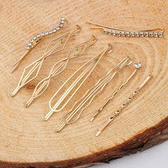 Folansy barrettes beside hand and ruler showing length range and scale