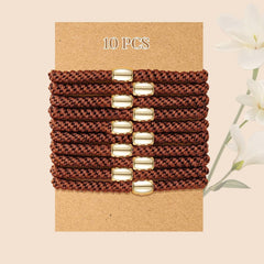 forenee hair tie beside coin for scale showing size and thickness benefit clear dimension reference