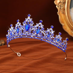 FORSEVEN tiara in hand for scale, conveys lightweight comfortable fit