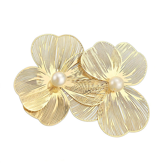 Fosrisix gold flower clip front view showing elegant design and polish