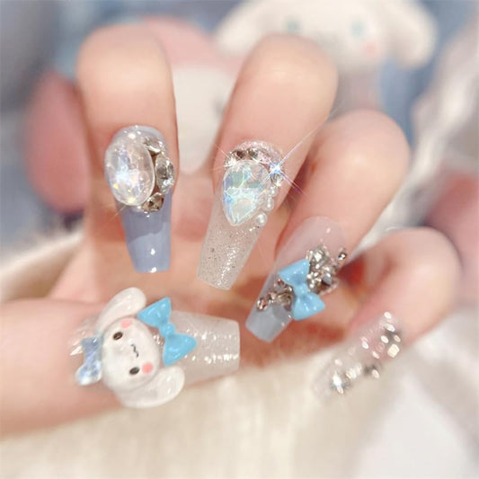 Foweso front packaging showing full 24-piece nail kit and charms benefit