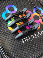 FRAMAR clip securing curly hair to show reliable grip on textured hair