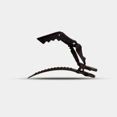 FRAMAR clip held in hand displaying size and ergonomic hold advantage