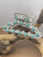 Frinnovan front view of turquoise hair claw clip, shows style and easy wear benefit