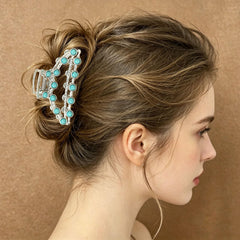 Frinnovan clip securing half-up hairstyle, shows quick styling convenience benefit