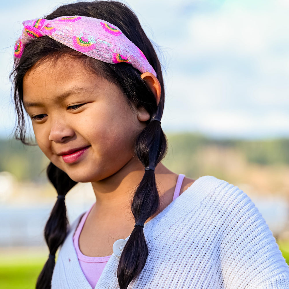 FROG SAC side profile of knotted headband, highlighting stylish knot detail