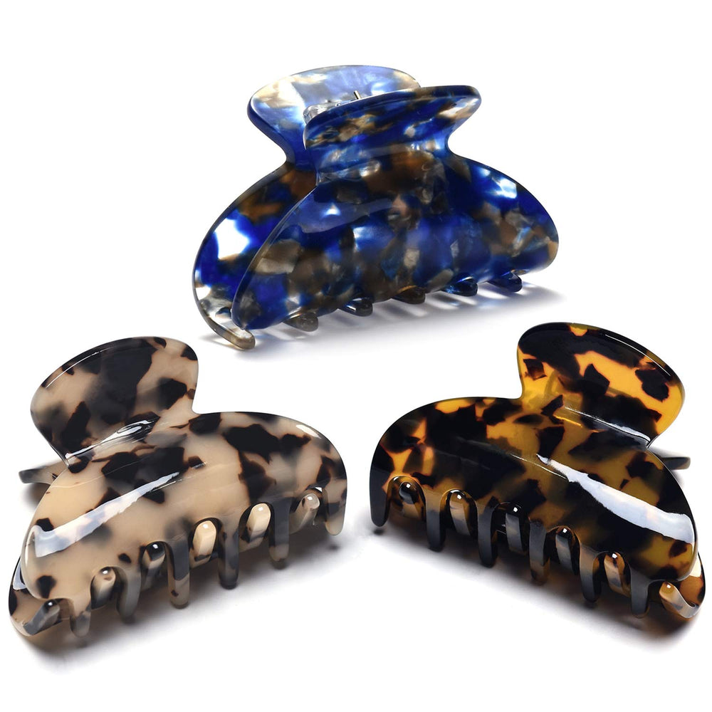Fsmiling front view of three tortoise claw clips showing pattern and size benefit