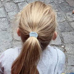 Funtopia hair band in use securing a high ponytail for stable hold