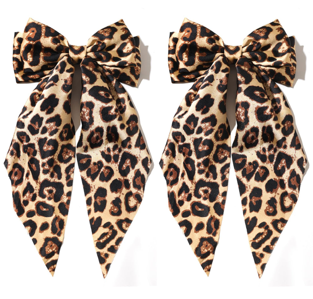 Furling Pompoms camel satin bow front packaging shows elegant camel shade and shape benefit
