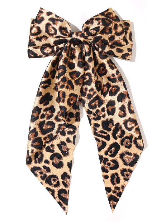 Furling Pompoms front view camel leopard bow adds bold style