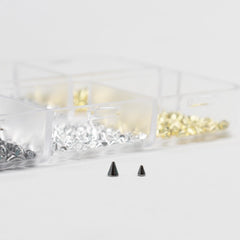 Ganepwns studs used with edgy outfit showing coordinated accessory styling benefit