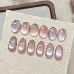 GAOY finished manicure on model showing peachy nude cat-eye look and wearable elegance