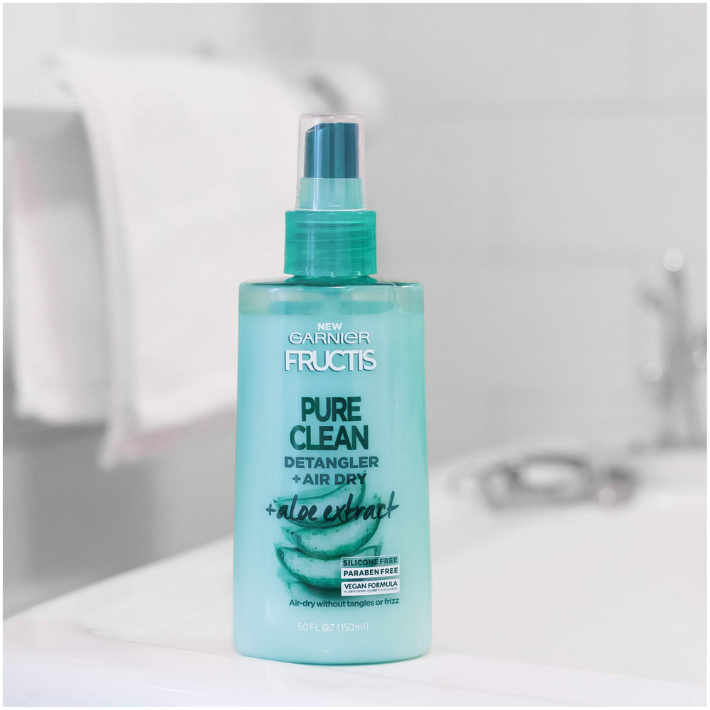 Garnier Fructis bottle in bathroom setting illustrating daily routine convenience