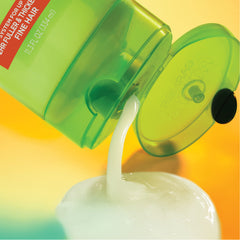 Garnier bottle next to hand showing 32.3 fl oz size clarity