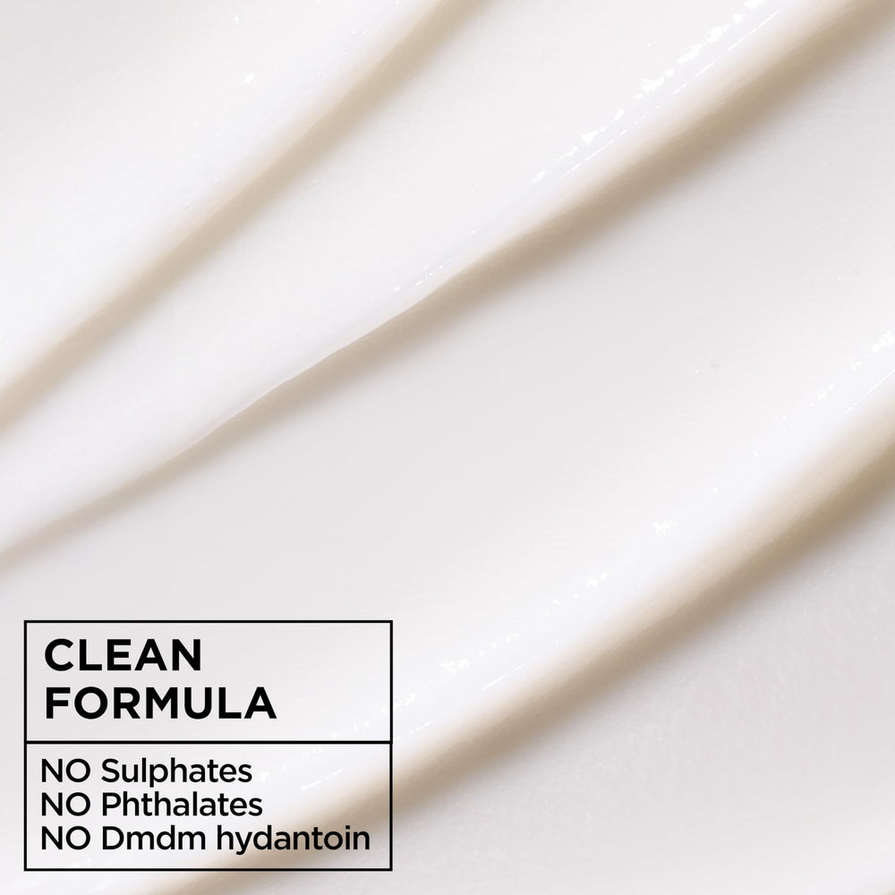 Garnier Fructis recycled plastic bottle close-up emphasizing greener packaging
