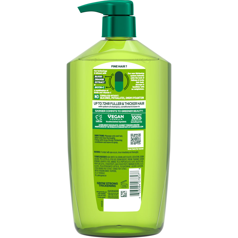 Garnier Fructis on bathroom shelf in bright setting showing sustainable bottle