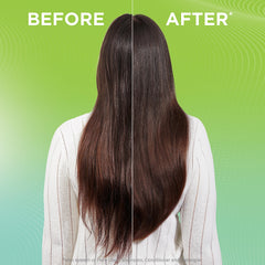 Garnier Fructis spray being applied to hair for easier detangling and frizz control