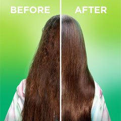 Garnier Fructis spray being applied to damp hair for detangling