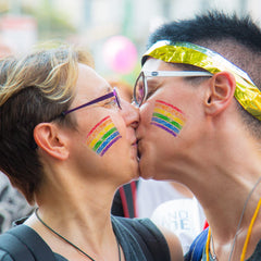 GCCL lifestyle image at a parade displaying bold rainbow face paint and festive energy