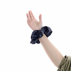 Gebelle oversized scrunchie creating a voluminous bun with soft hold