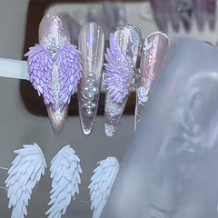 Gehaiwo finished wing charms applied to nails demonstrating styling options