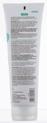 Gena tube held in hand for scale, conveys portable, travel-ready benefit