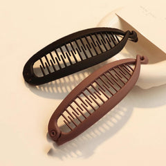 Generic banana clip side profile highlighting curved shape for volume