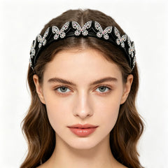 Generic butterfly headband held in hand to show compact size and lightweight benefit