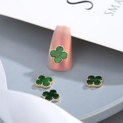 Generic clover charm placed on acrylic nail in use demonstrating secure decorative accent