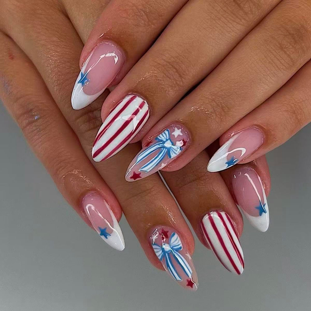 Generic brand front packaging displaying blue bow press-on nails, showing set contents and festive appeal