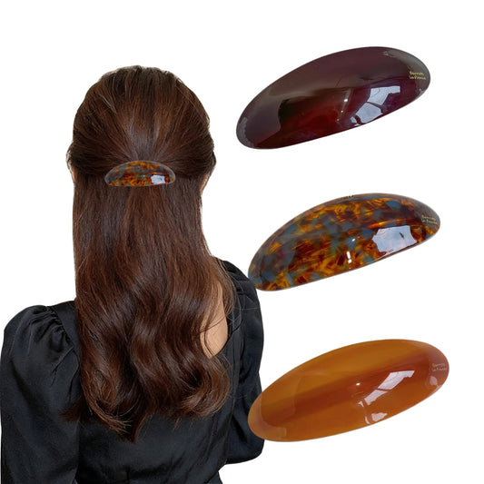 Generic front view of tortoise shell barrette showing polished acetate and secure hold