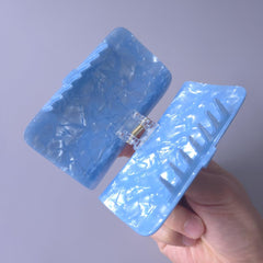 Generic sardine can clip teeth closeup highlighting long-toothed grip for security