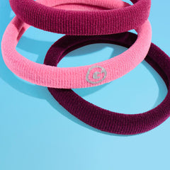 GIMME hair tie in hand to show medium size and easy handling