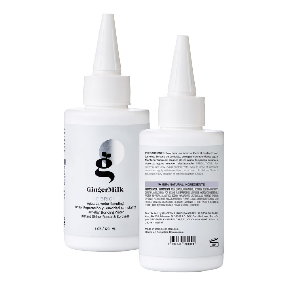 Ginger Milk bottle next to hand to show 4 oz scale for travel-friendly use