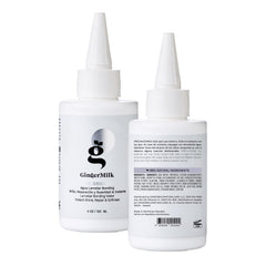 Ginger Milk bottle next to hand to show 4 oz scale for travel-friendly use