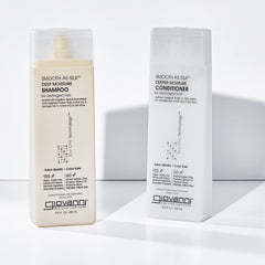 GIOVANNI conditioner in hand detangling hair with improved slip benefit