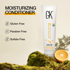 GK HAIR 100ml bottle held in hand showing compact travel-friendly size