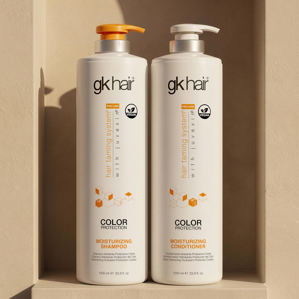 GK HAIR bottles in hand for scale, highlighting large 33.8 oz size and lasting supply