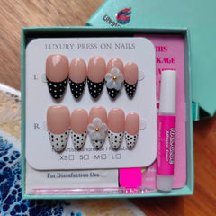 Gleamrain size comparison on finger illustrating medium almond fit for most nails