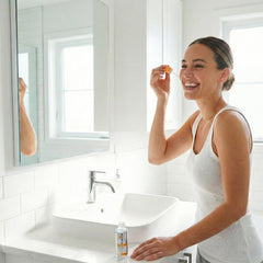 Global Beauty Care serum next to moisturizer and SPF, layering for daily routine