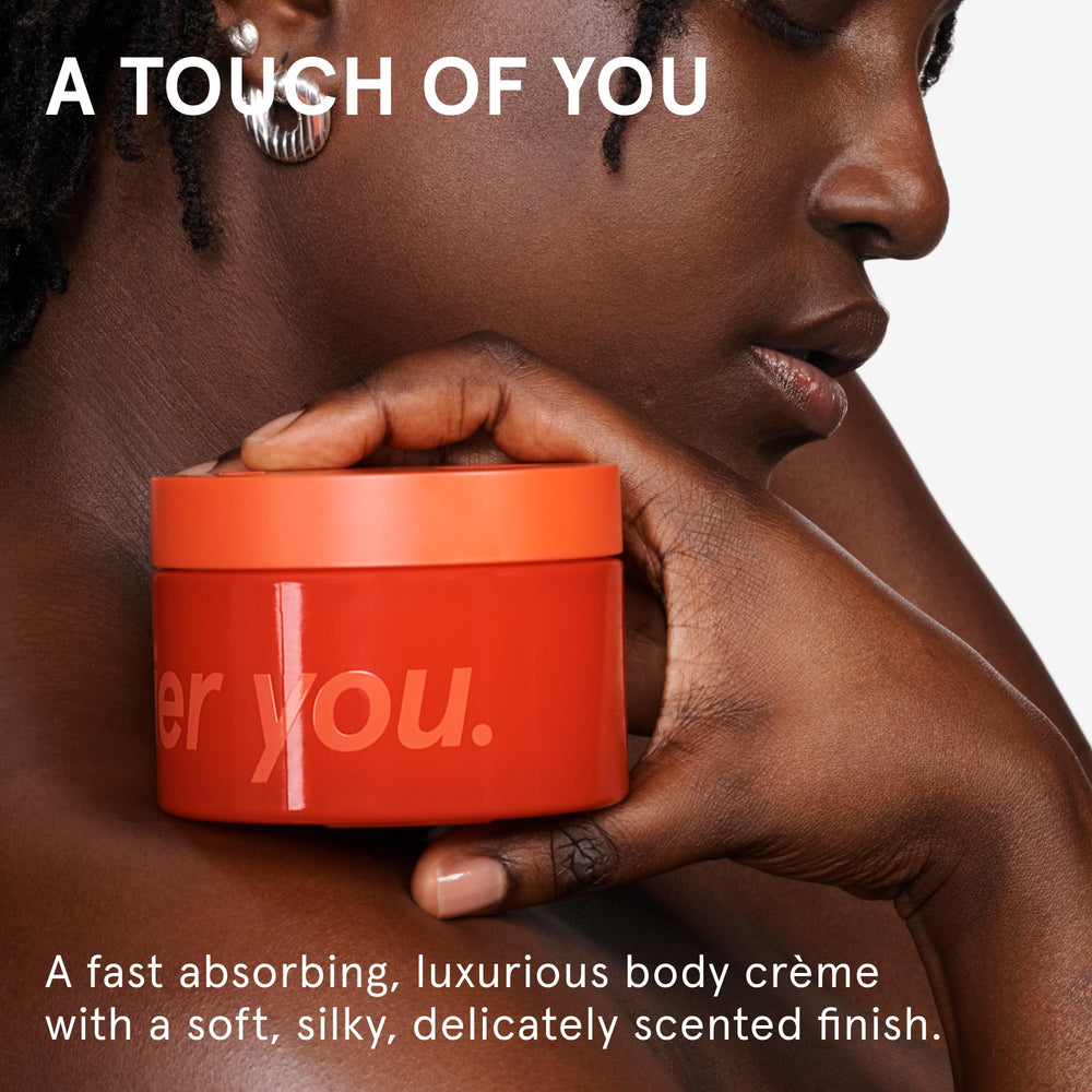 Glossier open jar displaying creamy texture, conveys smooth application and quick absorption