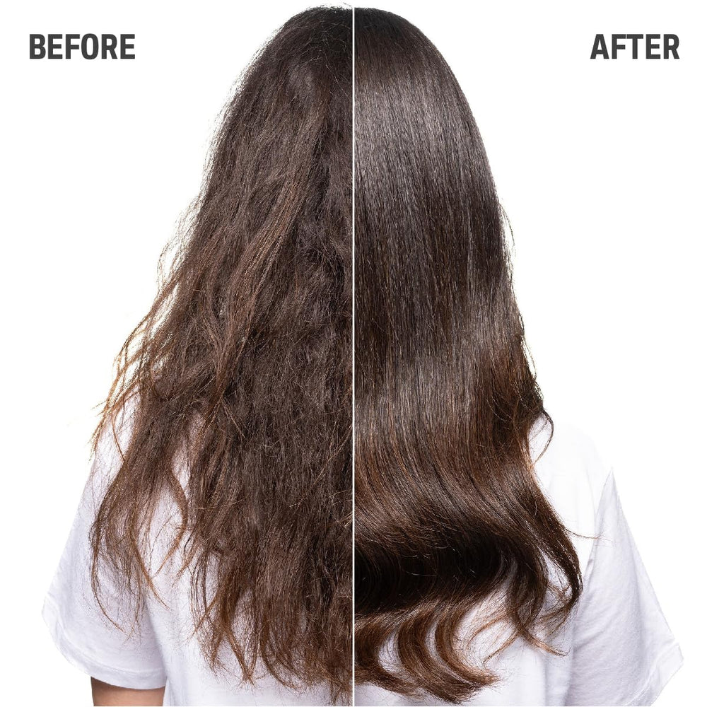 Goldwell Just Smooth bottle held in hand for size comparison highlighting large salon quantity